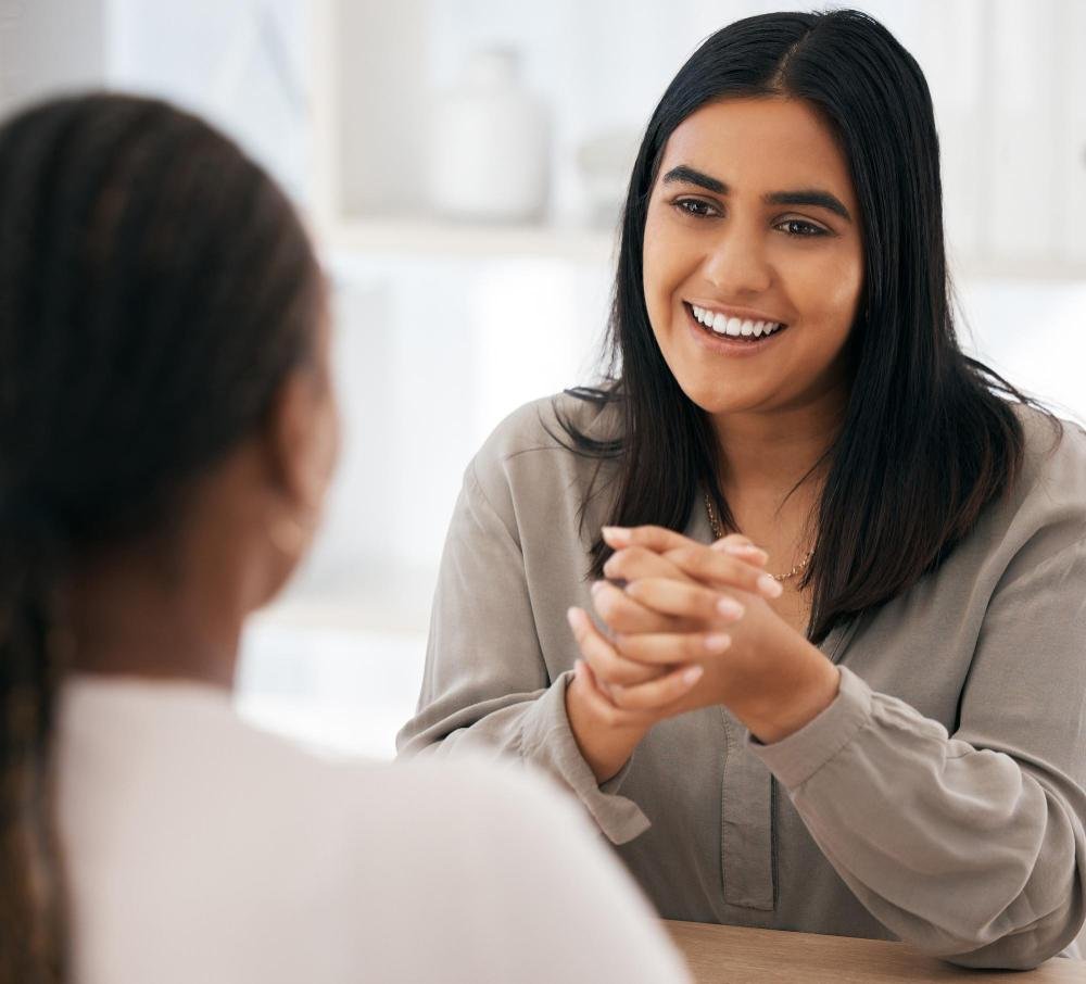 A female psychologist is providing counselling and therapy services for depression.